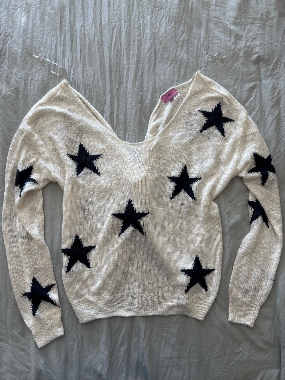 Francesca's Collections Cream V-Neck Sweater with Black Star Pattern